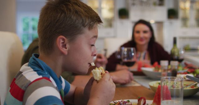 Young Boy Enjoying Dinner with Family at Home - Download Free Stock Images Pikwizard.com