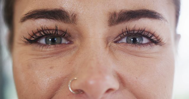 Close-Up of Woman's Eyes and Nose, Gold Nose Ring, Long Eyelashes - Download Free Stock Images Pikwizard.com