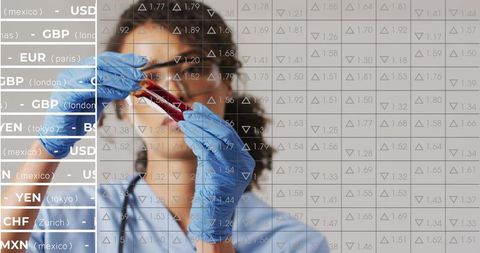 Clinician examining blood vial with financial data overlay, medical lab analytics concept