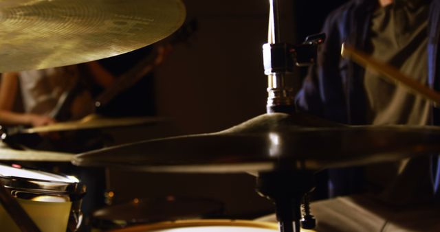 Drummer playing drum in recording studio