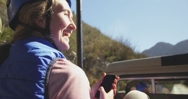 Woman Enjoying an Outdoor Adventure with Mobile Phone - Download Free Stock Images Pikwizard.com