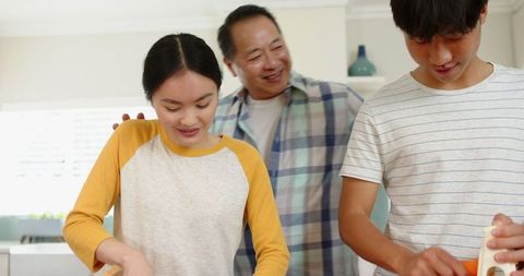 Family Enjoying Morning Rituals while Preparing Breakfast Together