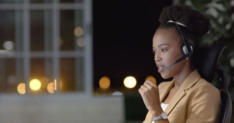 Businesswoman on Late Night Call, Blurred City Lights