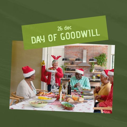 Happy group celebrating day of goodwill with festive dinner