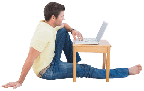 smiling man using laptop sitting on floor isolated and semi-transparent - Download Free Stock Videos Pikwizard.com