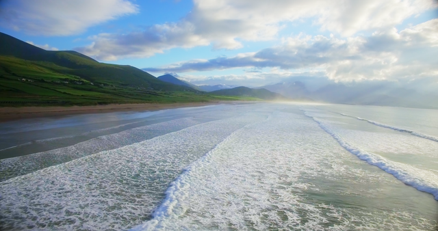 Scenic Endless Ocean Waves and Peaceful Mountain Scenery with Transparent Sky - Download Free Stock Videos Pikwizard.com