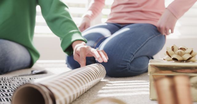 Friends Wrapping Gifts Together on Floor - Download Free Stock Images Pikwizard.com