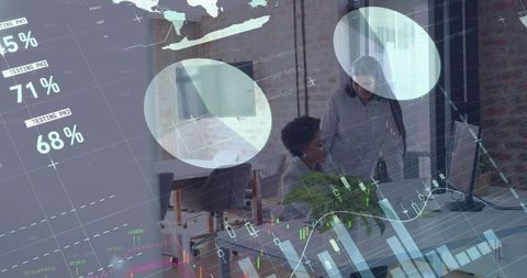 Businesswomen Analyzing Data with Financial Charts Overlay