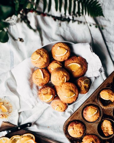 Freshly baked lemon muffins on rustic table