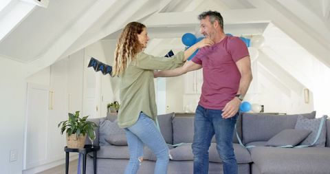 Happy Couple Celebrating Together with Festive Decor