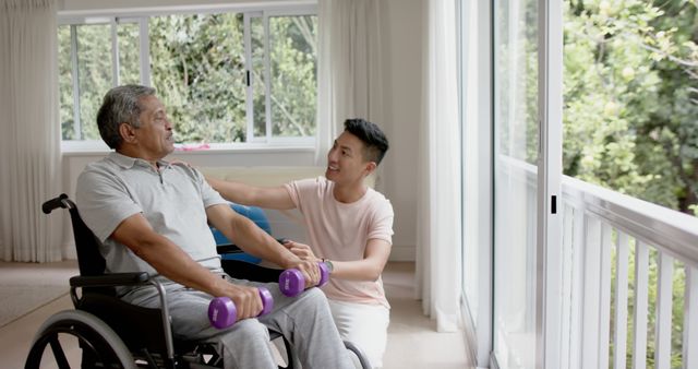 Senior Man in Wheelchair Exercising with Caregiver in Room with Large Windows - Download Free Stock Images Pikwizard.com