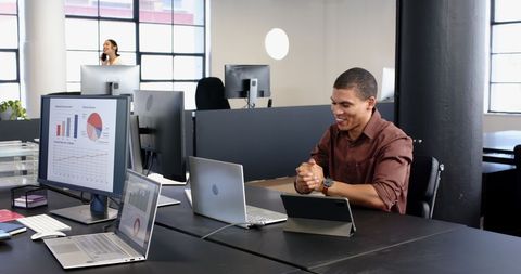 Businessman Celebrating Success in Modern Office Setup