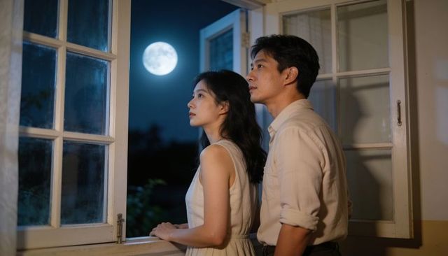 Couple gazing at full moon through open window, moonlit night romance and intimate moment