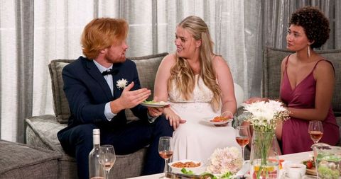 Mixed friends celebrating at casual wedding reception