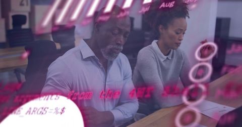 Diverse Business Team Analyzing Financial Data in Office Background