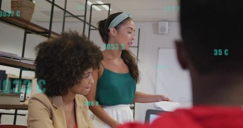 Woman Presenting Project and Leading Team Collaboration Around Laptop and Documents in Office