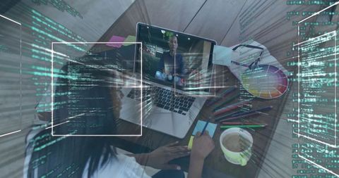 Creative professional juxtaposes design and coding in modern workspace