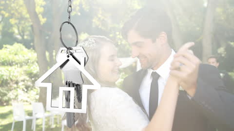 Newlywed Couple Dancing with House Keys Overlay