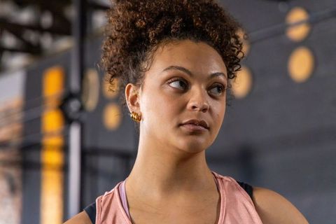 African american woman gazing after workout, focused athlete training closeup