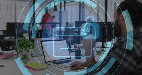 Cybersecurity workspace showing developer working on laptop with digital lock HUD overlay