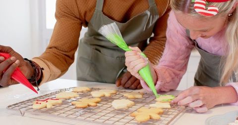 Diverse Friends Decorating Holiday Cookies Together