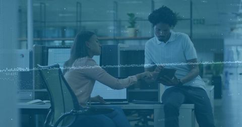 Collaborative Professionals Analyzing Data in Modern Office