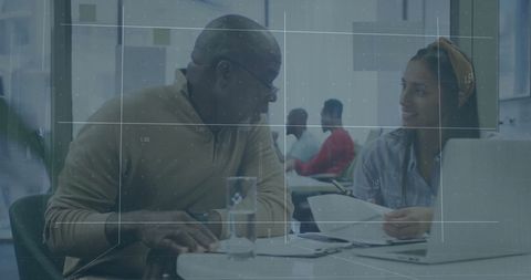 Business Colleagues Collaborating in Modern Office with Digital Overlay