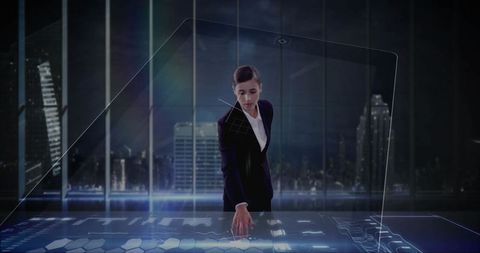 Businesswoman using holographic interface in modern office