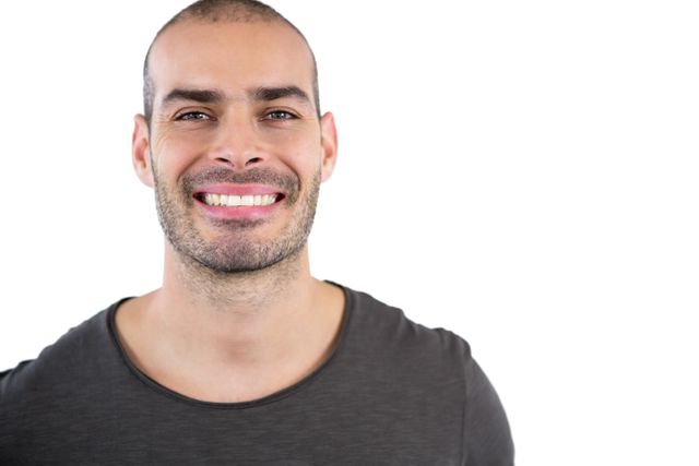 Portrait of man smiling against white background