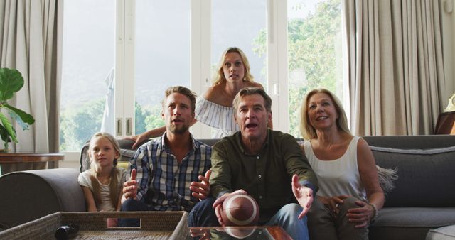 Excited Family Watching Sports Game on Television - Download Free Stock Images Pikwizard.com