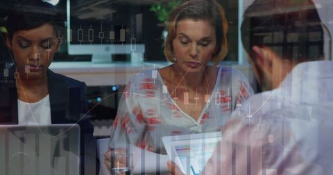 Diverse Team Analyzing Financial Stock Market Data Together