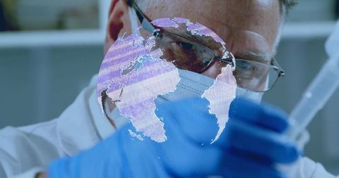 Scientist conducting laboratory research with digital globe overlay