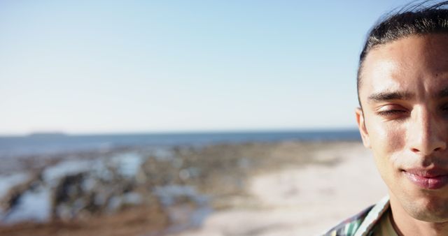 Man with Eyes Closed Enjoying Tranquil Beach - Download Free Stock Images Pikwizard.com