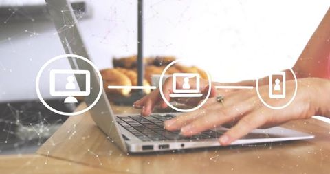 Typing Hands on Laptop with Network Icons in Cozy Cafe for Remote Collaboration