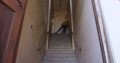 Expressive Caucasian Male Dancing in an Abandoned Staircase - Download Free Stock Images Pikwizard.com