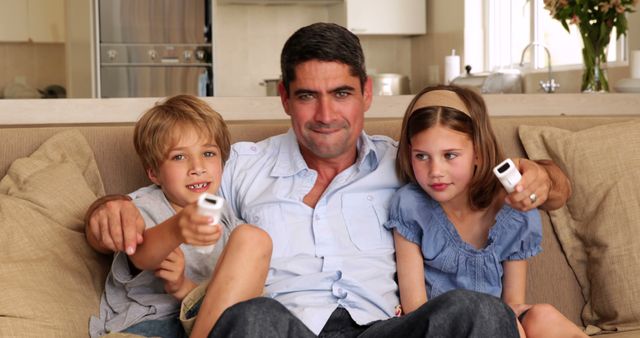 Father Bonding with Two Children on Living Room Sofa - Download Free Stock Images Pikwizard.com