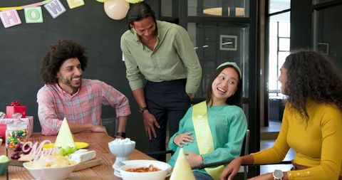 Diverse Colleagues Celebrate Baby Shower in Modern Office