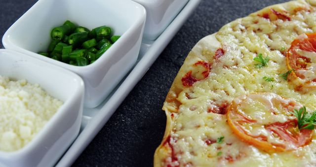 Close-Up of Freshly Baked Cheese Pizza with Toppings and Condiments - Download Free Stock Images Pikwizard.com