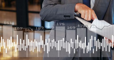 Businessman Analyzing Data with Graph Overlay on Tablet