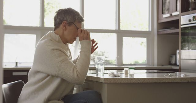 Elderly Woman Using Medication in Kitchen - Download Free Stock Images Pikwizard.com