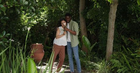 Romantic Couple Enjoying Picnic in Serene Garden Setting