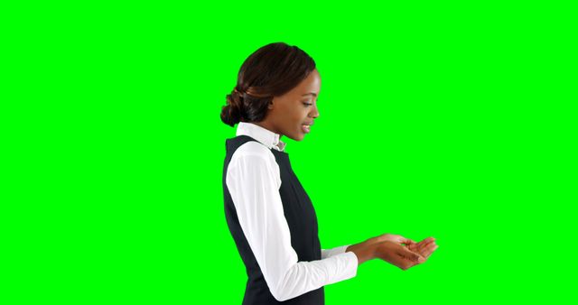 Professional African American Woman Presenting Virtual Object on Green Screen - Download Free Stock Images Pikwizard.com