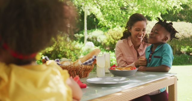 Mother and Children Enjoying Outdoor Picnic on Sunny Day - Download Free Stock Images Pikwizard.com