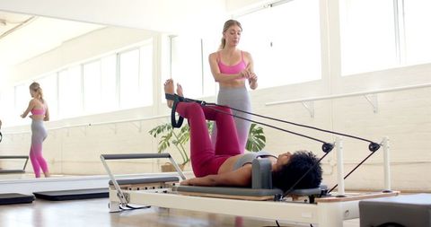 Personalized Pilates Training with Expert Instructor in Sunlit Studio - Download Free Stock Images Pikwizard.com