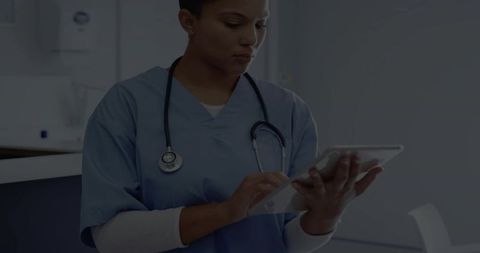 Nurse Utilizing Tablet in Modern Clinical Setting