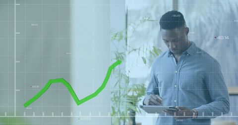Businessman Analyzing Financial Data with Digital Graph Overlay