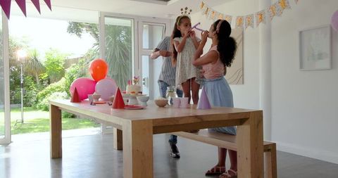 Family Birthday Celebration with Cakes and Balloons