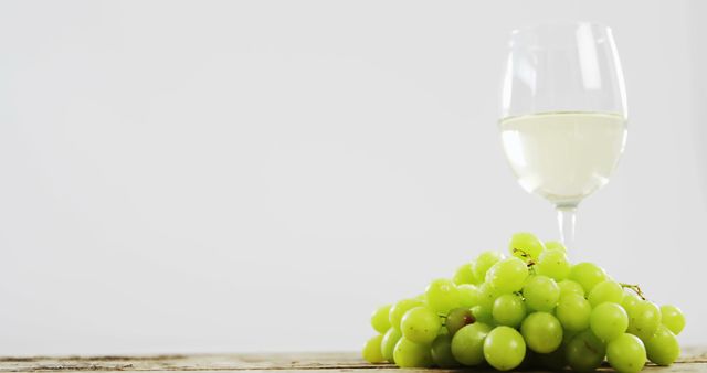 Glass of White Wine with Fresh Green Grapes on Rustic Table - Download Free Stock Images Pikwizard.com