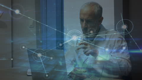 Senior Businessman Analyzing Data with Futuristic Network Overlay