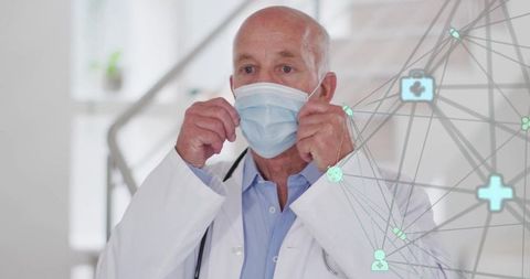 Doctor adjusting face mask with medical technology overlay